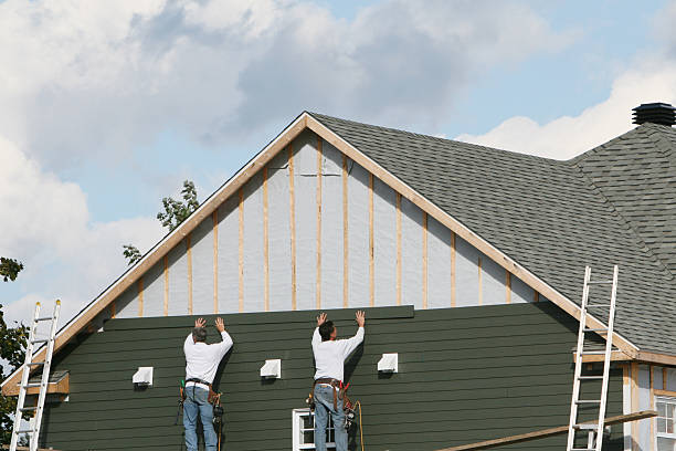 Professional Storm Damage Siding Repair technician working in Newtown, VA